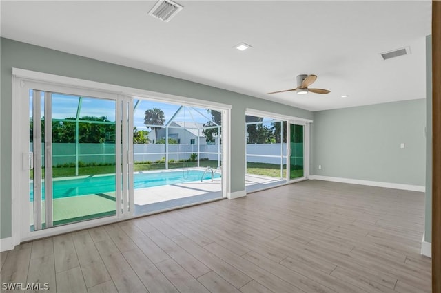 interior space featuring light wood-type flooring and ceiling fan