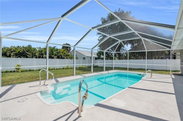 view of swimming pool featuring glass enclosure, a lawn, and a patio area