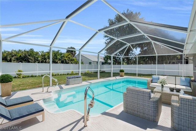 view of pool with a patio, a fenced backyard, a lanai, outdoor lounge area, and a fenced in pool