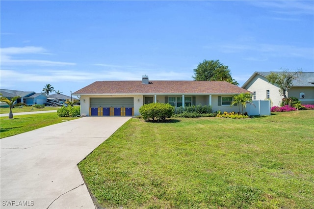 ranch-style home featuring a garage, driveway, and a front lawn