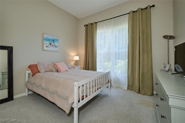 bedroom with light carpet