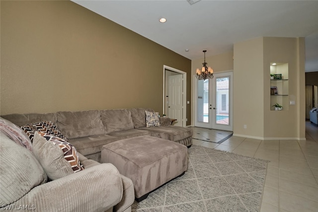 living room with french doors, a notable chandelier, and light tile patterned floors