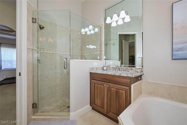 bathroom featuring tile patterned flooring, plus walk in shower, and vanity