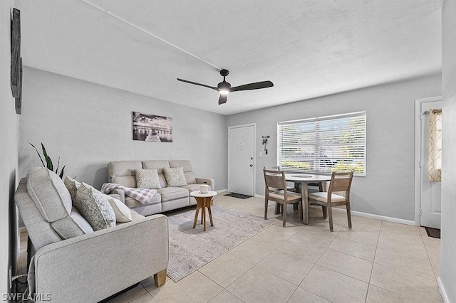 tiled living room featuring ceiling fan