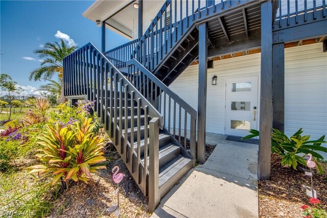 entrance to property with a wooden deck