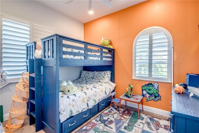 bedroom featuring wood-type flooring and ceiling fan