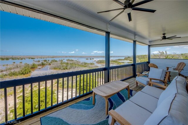 deck featuring a water view, ceiling fan, and an outdoor hangout area