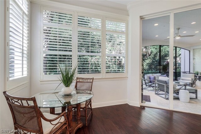 dining space with wood-type flooring and ceiling fan