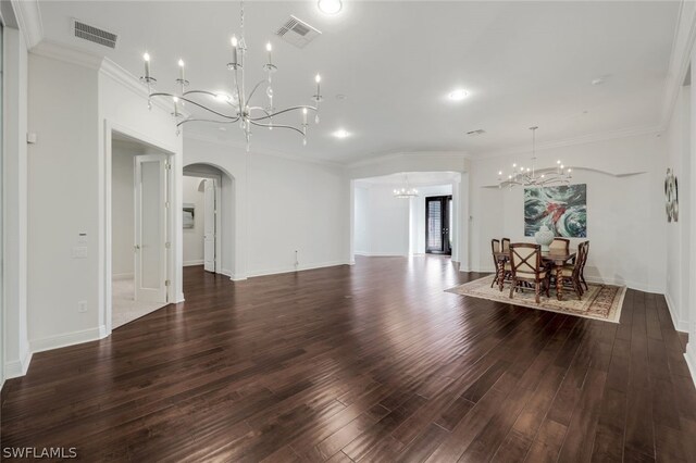 living room featuring ornamental molding, an inviting chandelier, and dark wood-type flooring