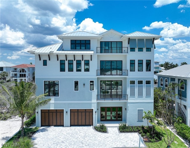 exterior space with a garage and a balcony