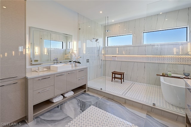 bathroom with tile walls, tile floors, walk in shower, and vanity