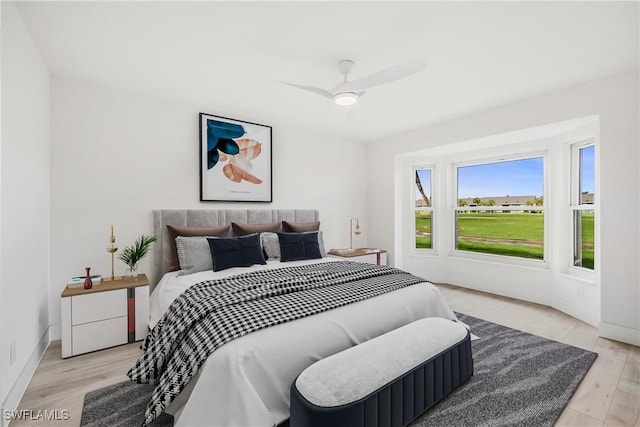 bedroom featuring light wood-type flooring and ceiling fan