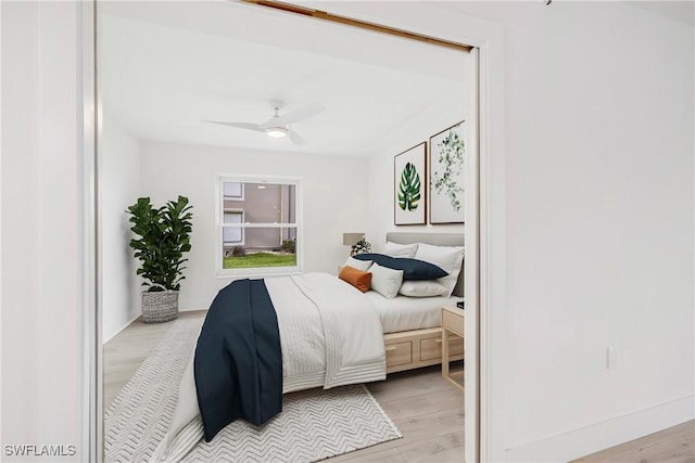 bedroom featuring ceiling fan and light hardwood / wood-style flooring