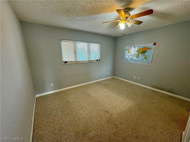 unfurnished room featuring carpet floors, ceiling fan, and a textured ceiling