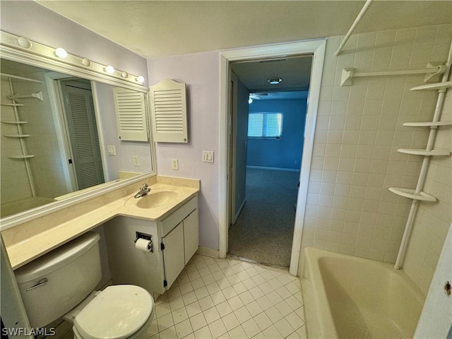 full bathroom with tiled shower / bath combo, tile patterned floors, vanity, and toilet