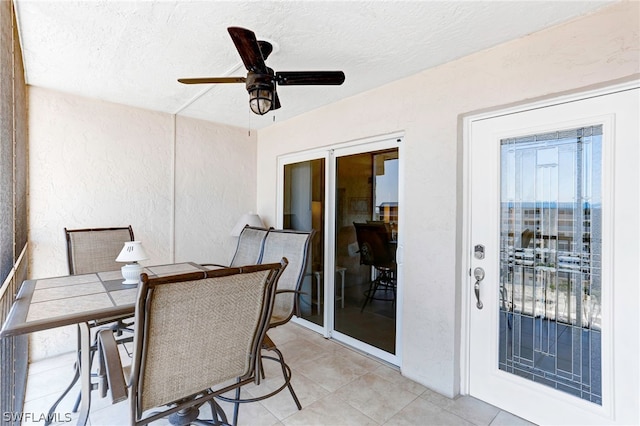 exterior space with ceiling fan