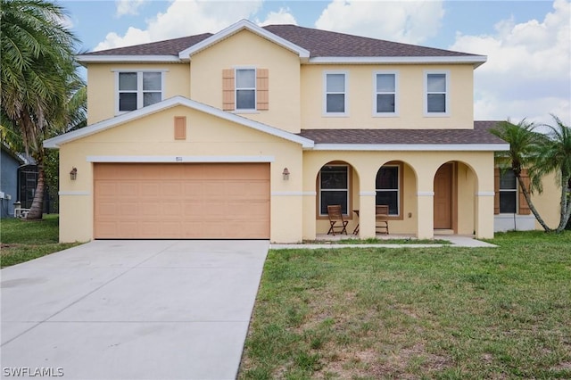 view of front of home with a garage, a front lawn, and covered porch