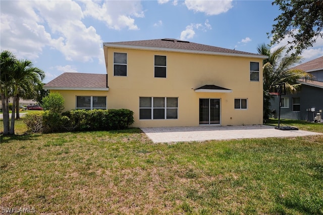 back of house featuring a yard and a patio area