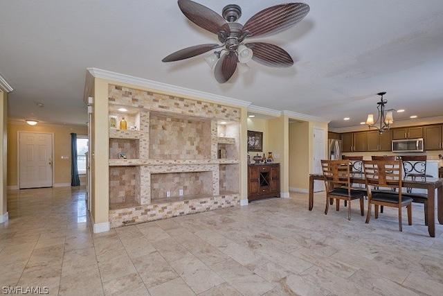 dining area featuring ornamental molding and ceiling fan with notable chandelier