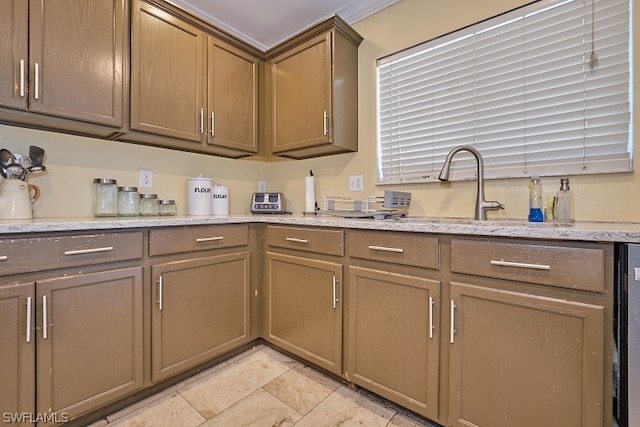 kitchen with sink and light stone countertops