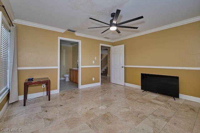 interior space featuring crown molding, ceiling fan, and connected bathroom