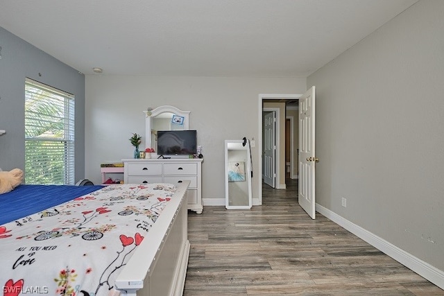 bedroom featuring dark hardwood / wood-style floors