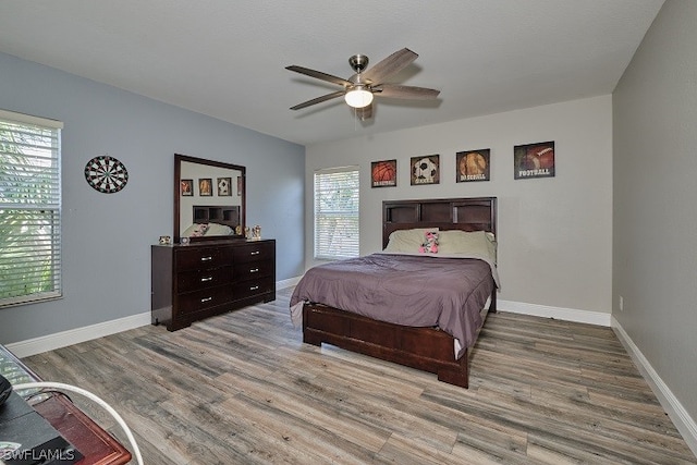 bedroom featuring ceiling fan and light hardwood / wood-style floors