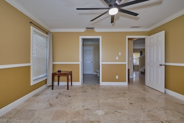 empty room with crown molding and ceiling fan