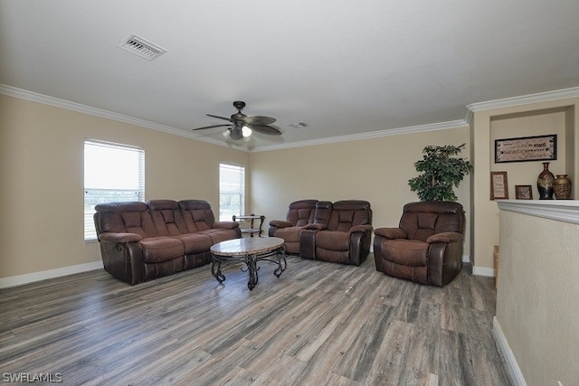 living room with hardwood / wood-style flooring, ornamental molding, and ceiling fan