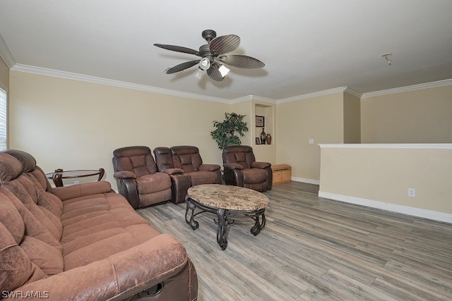 living room with hardwood / wood-style floors, ornamental molding, and ceiling fan