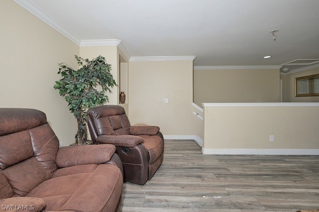 living room with crown molding and light wood-type flooring