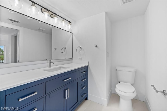 bathroom with toilet and vanity