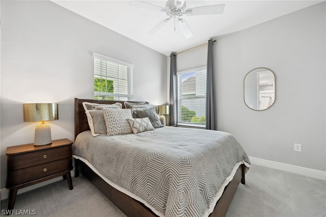 bedroom featuring ceiling fan and light colored carpet