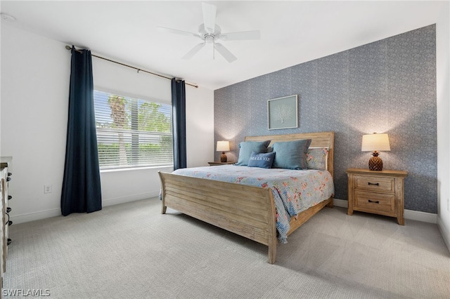 bedroom featuring ceiling fan and light colored carpet