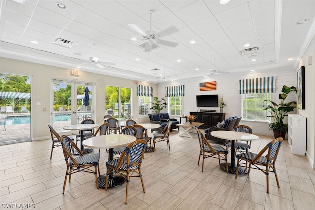 dining room featuring a wealth of natural light, french doors, ceiling fan, and ornamental molding