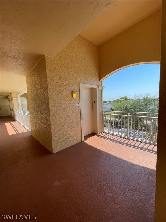 view of patio featuring a balcony