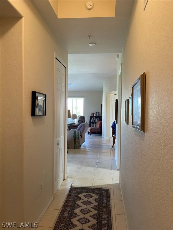 corridor with light tile patterned floors