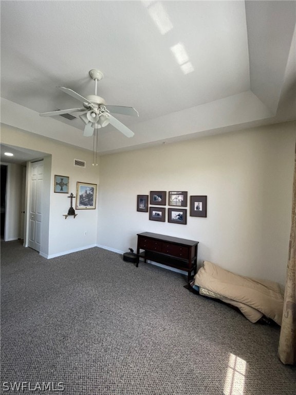 sitting room with carpet and ceiling fan