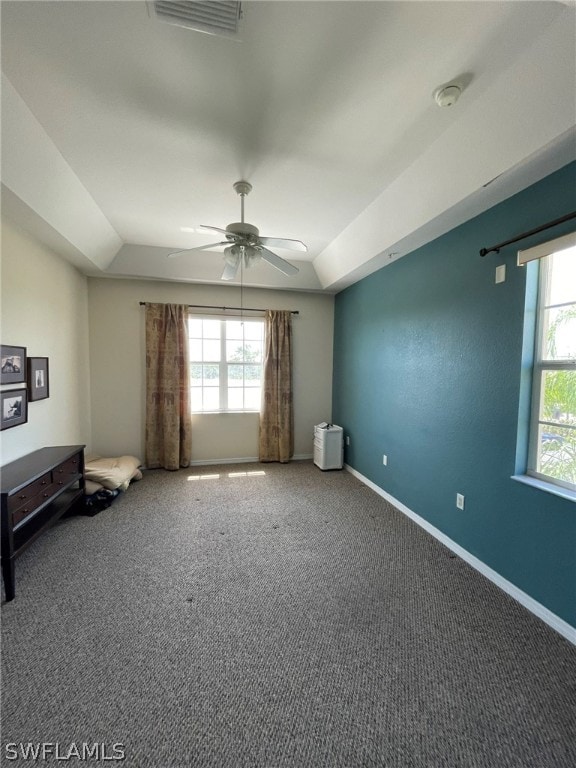 spare room featuring carpet flooring and ceiling fan