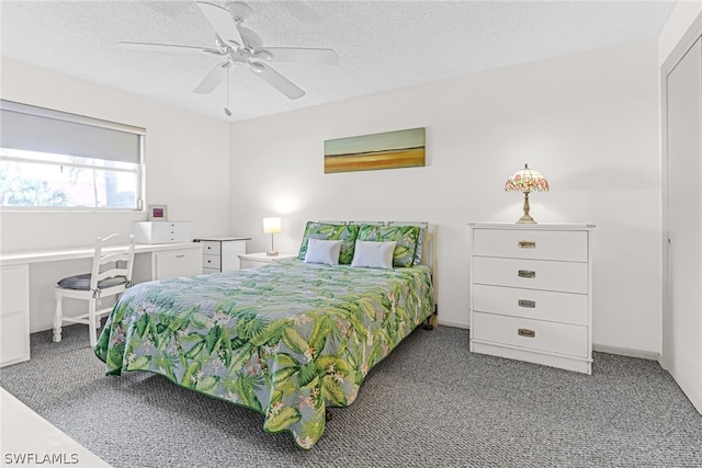 bedroom with carpet floors, a textured ceiling, and ceiling fan