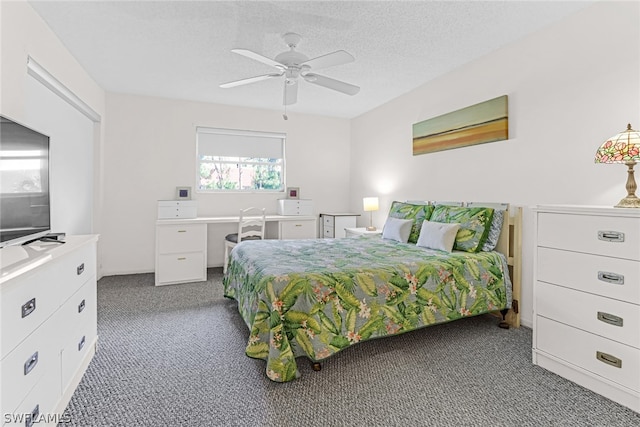 carpeted bedroom with ceiling fan and a textured ceiling