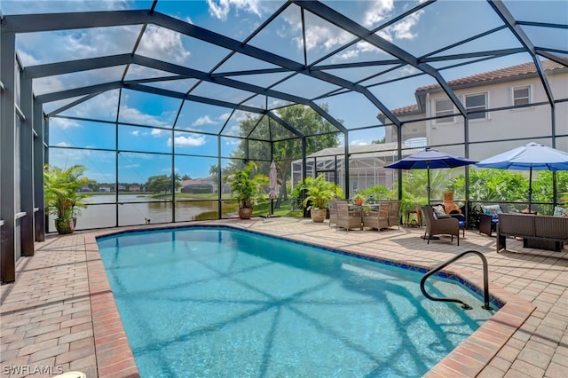 view of pool with a water view, a patio area, and a lanai