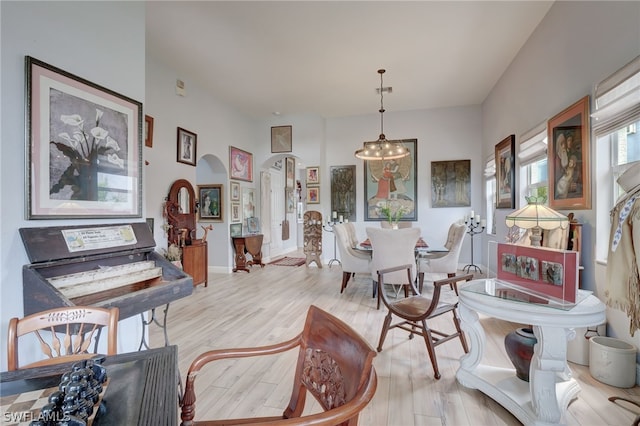 interior space featuring a chandelier and light wood-type flooring