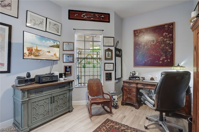 home office with light wood-type flooring