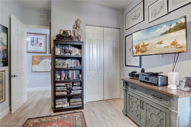 office area with light hardwood / wood-style flooring