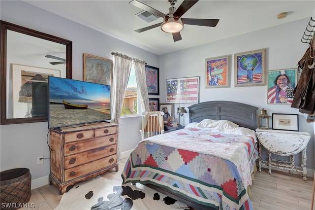 bedroom featuring light hardwood / wood-style floors and ceiling fan