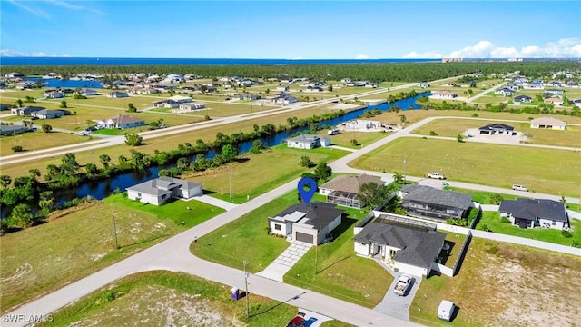 bird's eye view with a water view