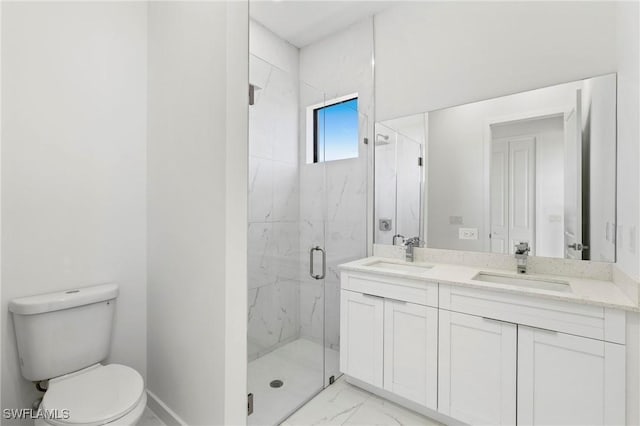 bathroom with vanity, toilet, and an enclosed shower