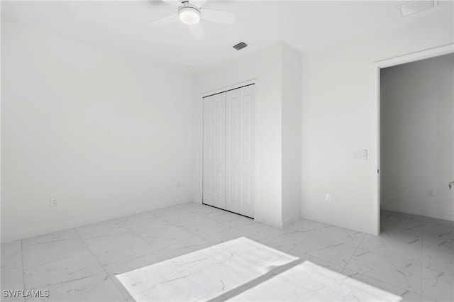 unfurnished bedroom with a closet and ceiling fan