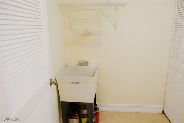 washroom with sink and light tile patterned floors